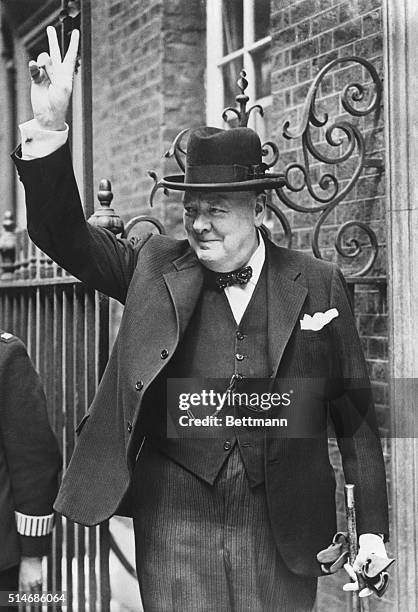 Prime Minister Winston Churchill makes the victory sign upon returning from a trip to Washington, DC and North Africa.