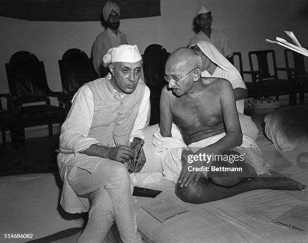 Bombay, India: The architect of India's independence from Great Britain, Mahatma Gandhi talks to his eventual successor, Rashtrapati Jawaharlal Nehru...