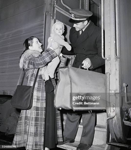 Chicago, IL: Six-month-old Jeffrey Chewning, who was born on H-hour of D-day, as Yank forces were storming the coast of Normandy, greets his daddy,...