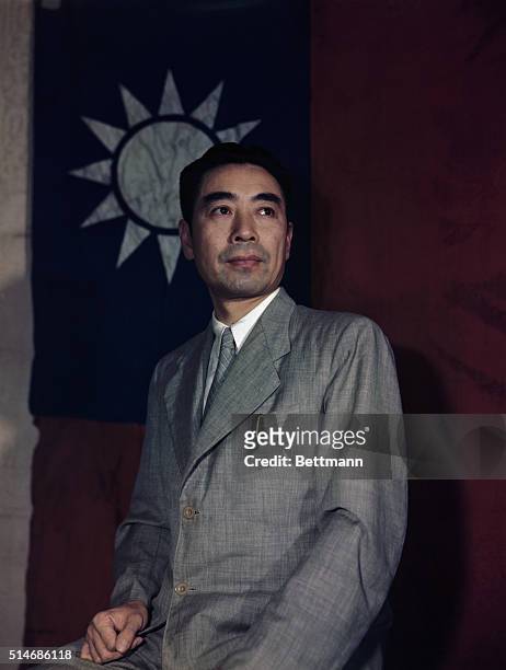 China: Communist General Chou- En-lai, with Chinese flag.