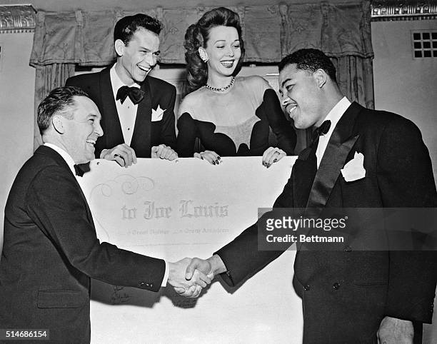 New York, NY: Heavyweight champion Joe Louis was honored as "A great fighter and a great American" at a dinner tendered to him by the Southern...