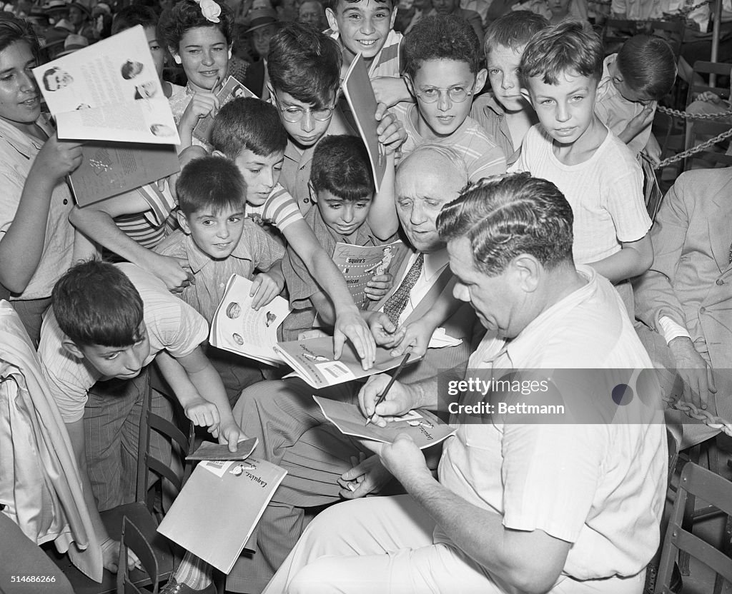 Babe Ruth Signing Autographs for Children