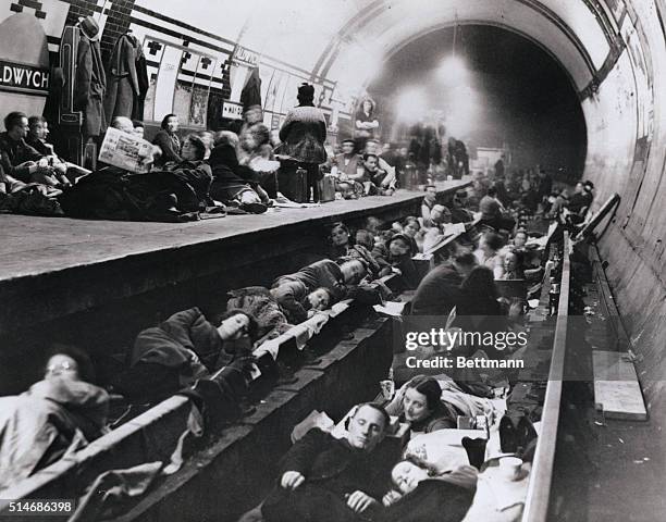 London, England: Weary London are shown catching up on sleep in the comparative safety of a tube station, taken out of service and converted into an...