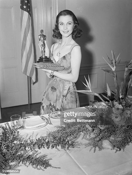 Vivien Leigh proudly holds her Best Actress Oscar on March 2, 1940. She was recognized for her portrayal of Scarlett O'Hara in Gone With the Wind.