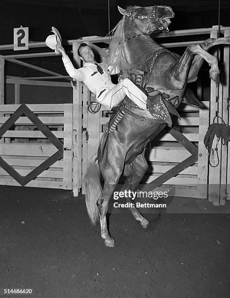 The Rodeo, starring Roy Rogers, singing cowboy star of republic pictures, held its dress rehersal at Madison Square Garden. Here, Roy Rogers is shown...