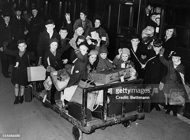 Group of children wave and cheer as they are evacuated from London to Devon from the war in 1939.