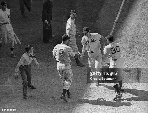 Detroit, Michigan: Ted Williams, the Boston Howitzer, crossing the plate in the 9th inning of yesterday's all-star game on the circuit blast which...