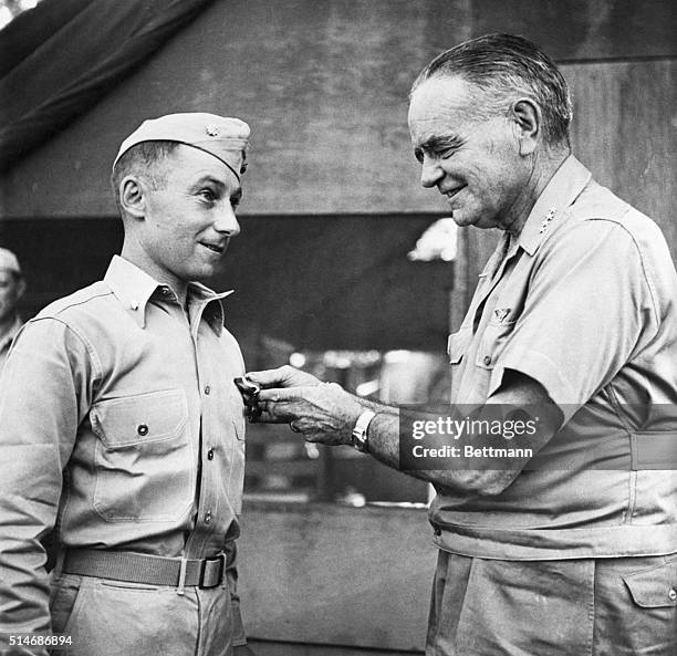 South Pacific: Admiral William F. Halsey, Commander, South Pacific Forces, as he presented the Navy Cross to Lt. Col. Victor H. Krulak, USMC, of...