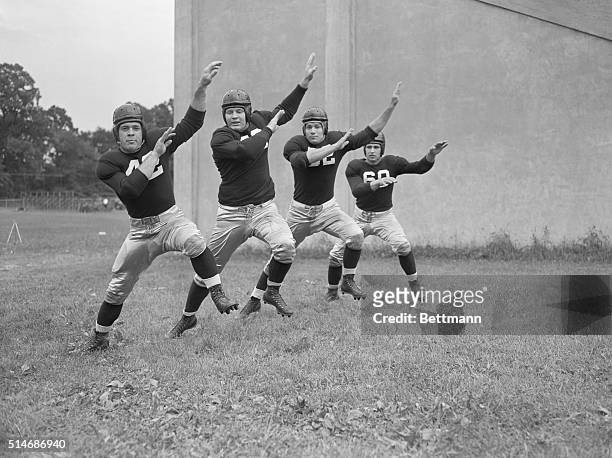Members of the Villanova University football team appear to be dancing in step during a fall practice on campus. From left, Russ Mazzei, Thomas...