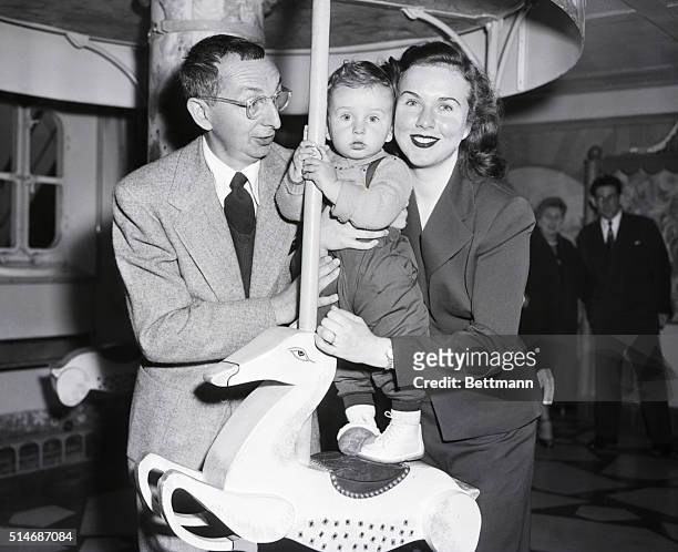 New York, NY: Deanna Durbin at age 30, with husband, French director Charles David, and 16 month old son Peter, on arrival aboard Ile De France.