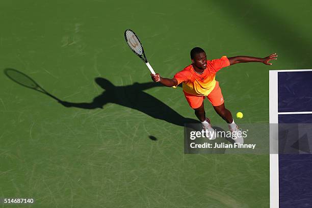 Frances Tiafoe of USA plays a forehand against Taylor Fritz of USA during day four of the BNP Paribas Open at Indian Wells Tennis Garden on March 10,...