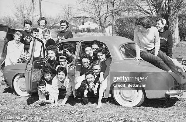 Sorority sisters fro Alpha Delta Pi and Delta Zeta pack into a tiny Renault to try and set a record of 27 women in a car. Car packing was a fad that...