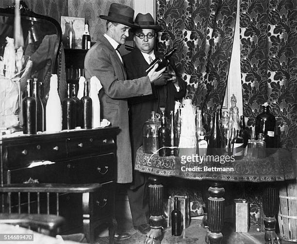 Alcohol raid on a speakeasy. 1926
