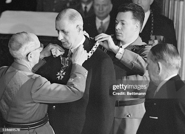 Paris, France: In the Elysee Palace here Jan. 8th, Gen. Charles De Gaulle receives the Grand Collar of the Legion of Honor as he takes office as the...