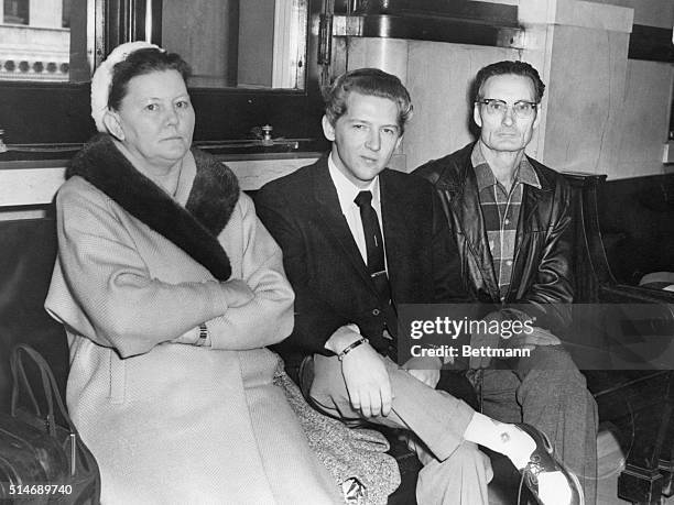 Jerry Lee Lewis attends court with his parents for back alimony pay. According to his ex-wife, Jane Mithcam Lewis, Jerry Lee was $1,000 behind in...
