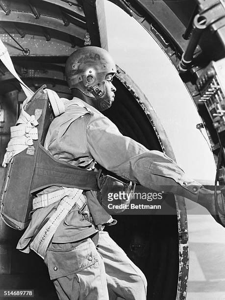 Pendleton, Oregon: AIRBORNE FIREFIGHTERS. A Afro-American paratrooper based at Pendleton, Oregon, Army Air Base, gets set as the plane nears the drop...