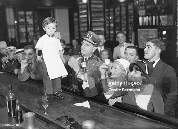 Havana, Cuba: Sloppy Joe, Jr., just four years of age and having two years behind the bar, is celebrating his graduation from apprenticeship by...