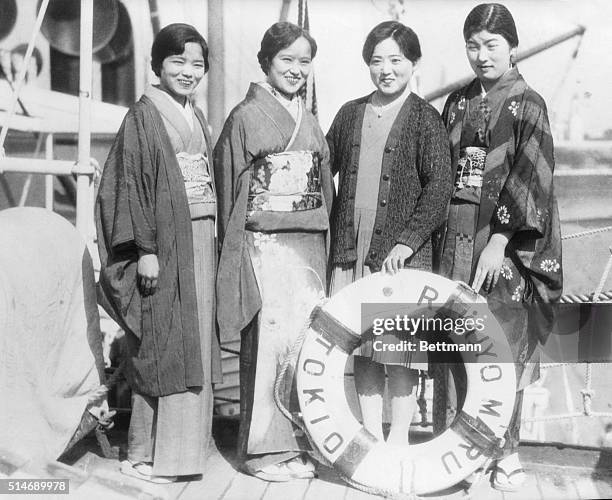 Los Angeles, CA: Japanese picture brides in a row. These four girls are about to board the Japanese liner "Rakuyo Maru" to join never-seen-before...