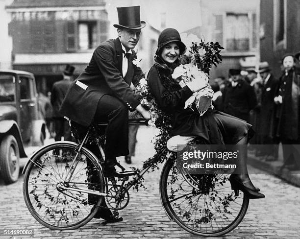 Paris, France: What may portend the return of the lowly bicycle to the realm of fashion is this startling parisian bridal conveyance upon which a...