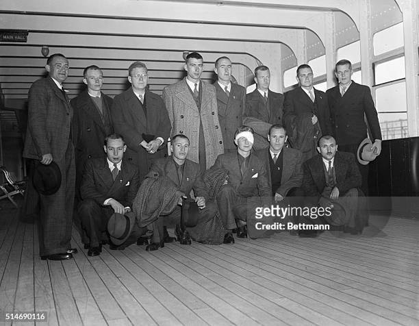 New York: Fourteen American lads, who volunteered to fight with the government forces in Spain, are shown aboard the S.S. Queen Mary as they returned...