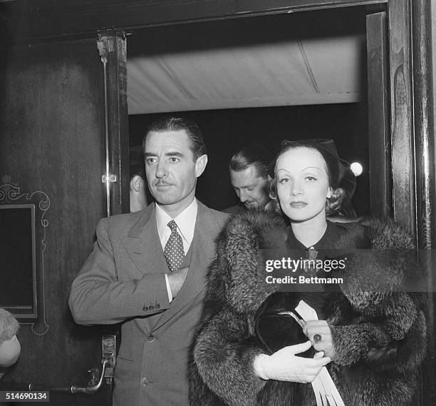 Hollywood, CA: Marlene Dietrich, beautiful film actress and John Gilbert, handsome leading man of the films, who are the newest couple to be spotted...