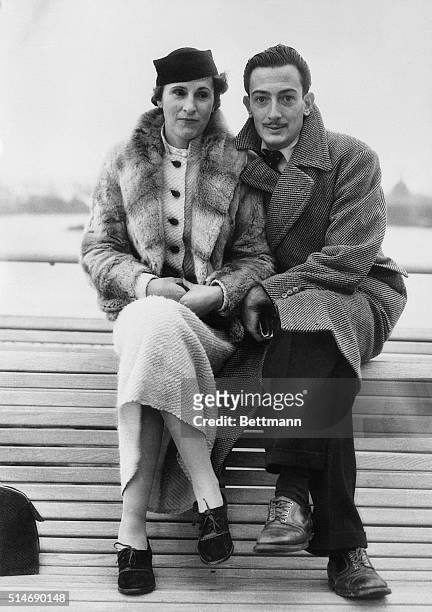 New York, NY: Mr. And Mrs. Salvador Dali, seen on the S.S. Champlain on their arrival November 14th. Mr. Dali is the well-known Spanish painter here...