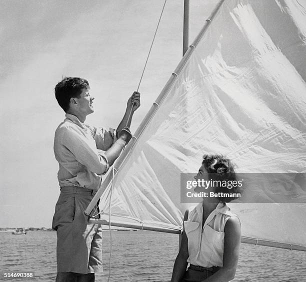 Hyannis Port, MA: Senator John F. Kennedy and his fiancee Miss Jacqueline Bouvier of Newport, relaxing at the Kennedy's summer home here. Kennedy is...