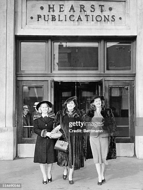 New York, NY: Columnist Louella Parsons is shown with June Pressier and Arleen Whelan, two of the movie starlets with she is touring, as they left...