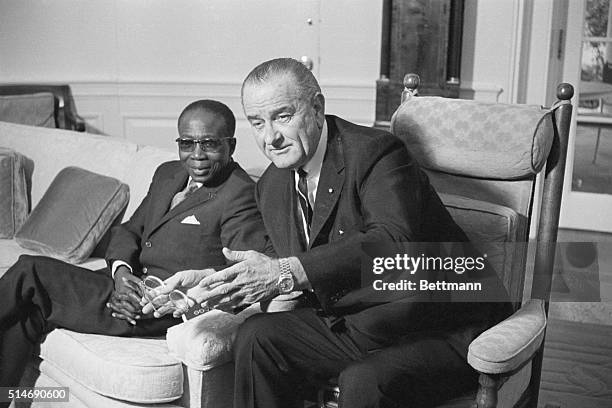 Washington, DC: State visitor. President Johnson chats in his office with President Leopold Senghor of Senegal today after the African Chief...