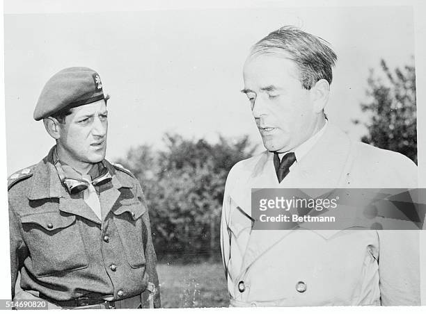 Germany: Captain Tony Solomon of London, questions Albert Speer, Reich Production Minister, after his arrest at Flensburg along with other members of...