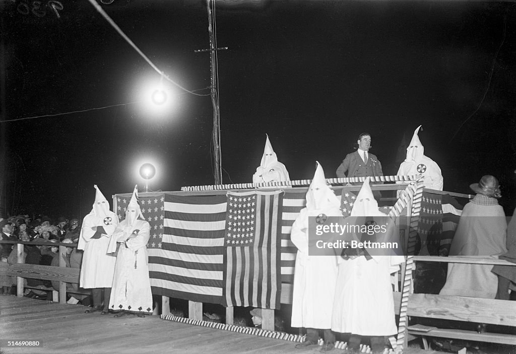 Ku Klux Klan Grouped Around Flag