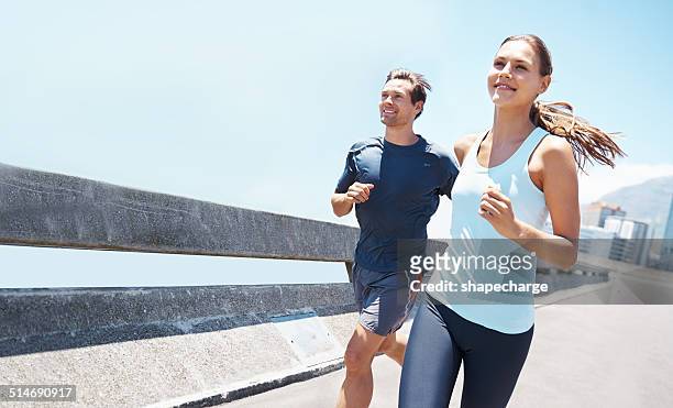 out running on a beautiful day - jogging stock pictures, royalty-free photos & images