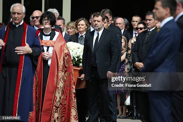 The pall bearers including actor and cousin Russell Crowe carry the casket after the funeral service for Martin Crowe on March 11, 2016 in Auckland,...