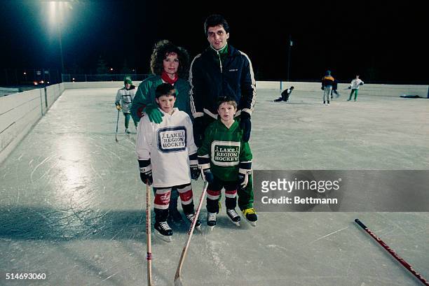 Buzz Schneider, who scored the winning goal against the Soviets in the 1980 Winter Olympics hockey match, stand with wife Gayle and sons Billy and...