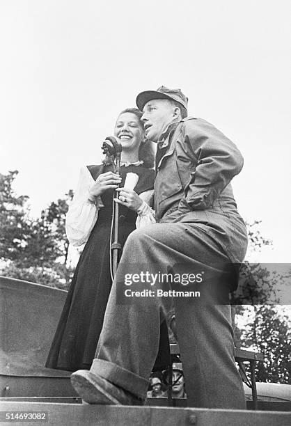 Dinah Shore and Bing Crosby entertain at a USO in France.