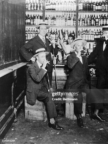 View of four men drinking at the Speakeasy Bar. Undated photograph.