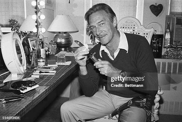 Christopher Plummer cleans the dagger he uses in Broadway production of "Othello" in which he plays Iago. Plummer was nominated for a Tony Award for...