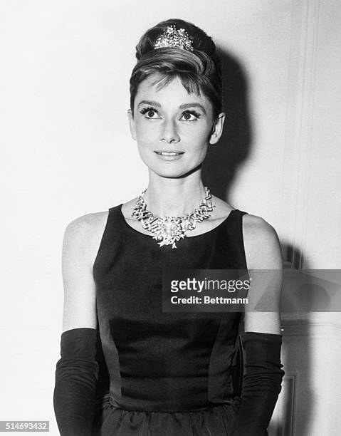 Audrey Hepburn, about to begin filming for Breakfast At Tiffany's, wears one of the store's most expensive diamond necklaces. New York.