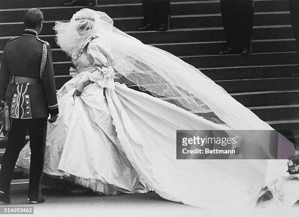 Lady Diana Spencer arrives at St. Paul's Cathedral on her wedding day, revealing to the world the wedding dress which had been carefully guarded...