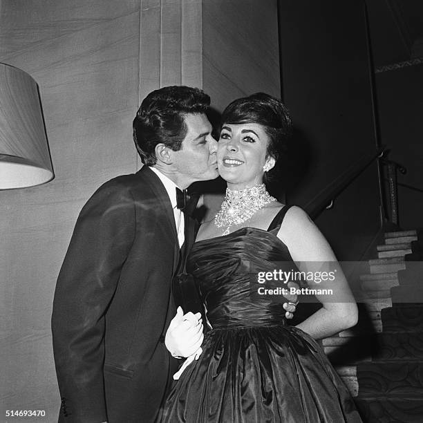 Singer Eddie Fisher kisses his wife Elizabeth Taylor before he goes onstage at the Waldorf Astoria. 1959.