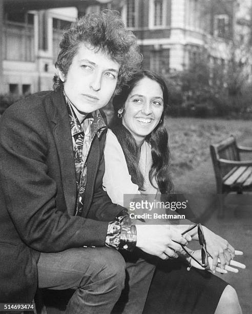 London, England: American folk singers Bob Dylan and Joan Baez shown seated together.