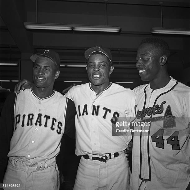 National League stars Roberto Clemente, Willie Mays, and Hank Aaron stand together for a victory portrait after the All-Star Game of 1961 in San...