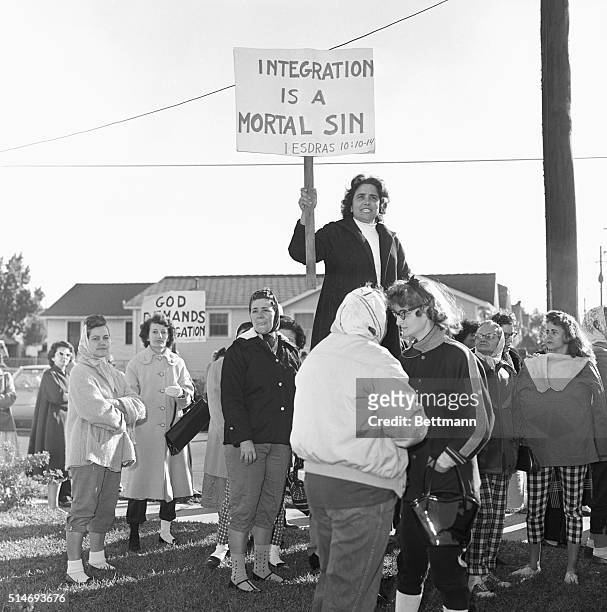 Mrs. Lee Hooks and other white housewives demonstrate against planned desegregation at William Franz Elementary School in New Orleans.