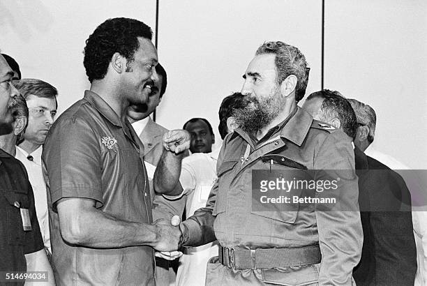 American religious and Civil Rights leader Reverend Jesse Jackson Sr shakes hands with Cuban leader Fidel Castro during a visit to Havana, Cuba, June...