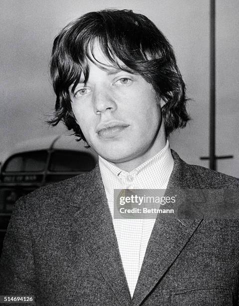 Rolling Stone lead singer Mick Jagger on arrival at the airport in London, England.