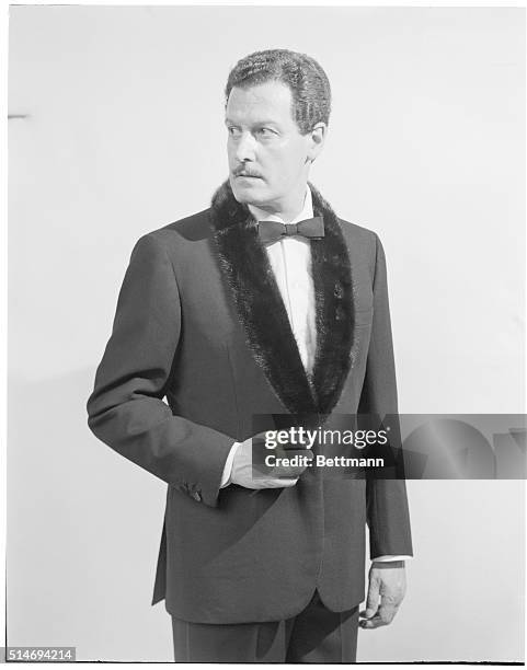 Male model wears a fur trimmed tuxedo designed by Brioni of Rome for a fashion show in Florence's Pitti Palace.