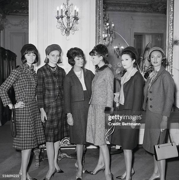 French designer Marie-Helene Aranud, a former Chanel model, stands with the models wearing her first ready-to-wear designs in the Grande Maison de...