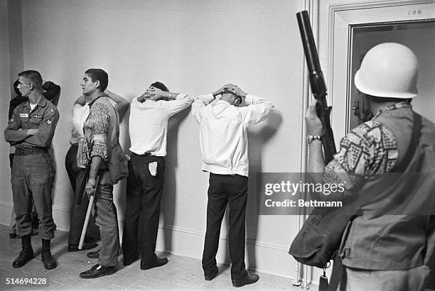Students stand against a wall after being arrested by US marshals during an upheveal on the University of Mississippi campus. The upheveal began...