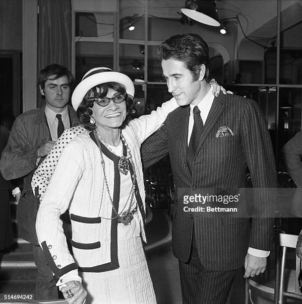 Fashion designer Coco Chanel with opera performer Jacques Chazot at her Paris salon.