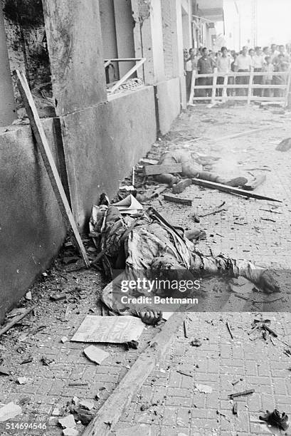 The body of a US embassy employee, killed by a terrorist bomb blast, lies outside the embassy in Saigon. | Location: United States Embassy, Saigon,...